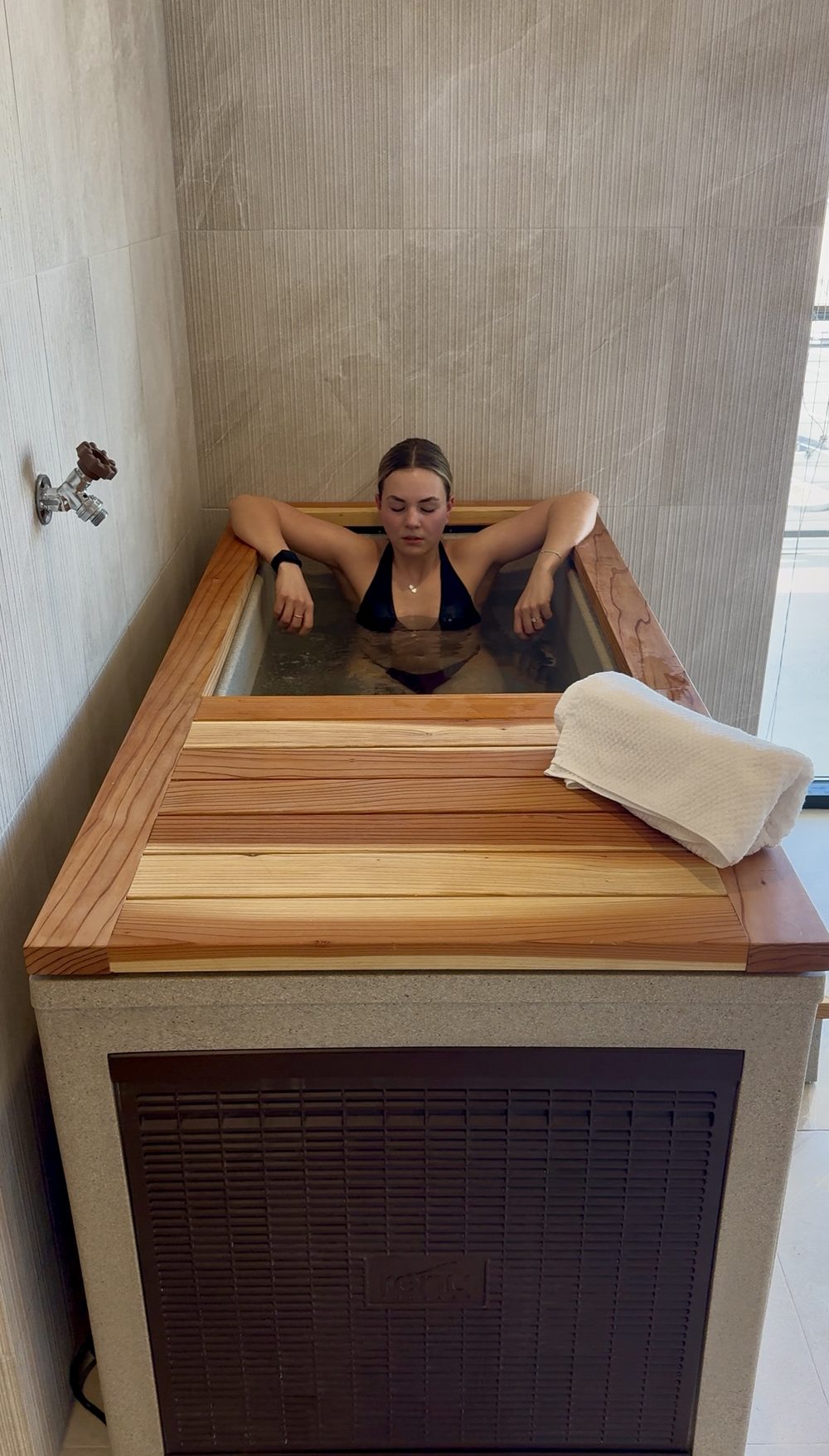 Man and woman doing sauna and cold plunge contrast therapy